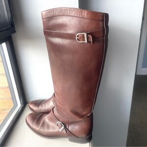 Tall brown leather riding boots
